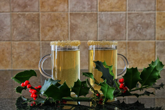 Spiced rum hot toddy using Swan Knight Distillery golden spiced rum in 2 glass mugs