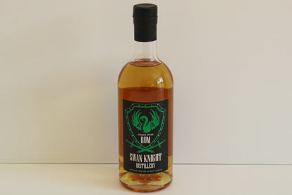 Single bottle of Swan Knight Distillery golden spiced rum on a white background